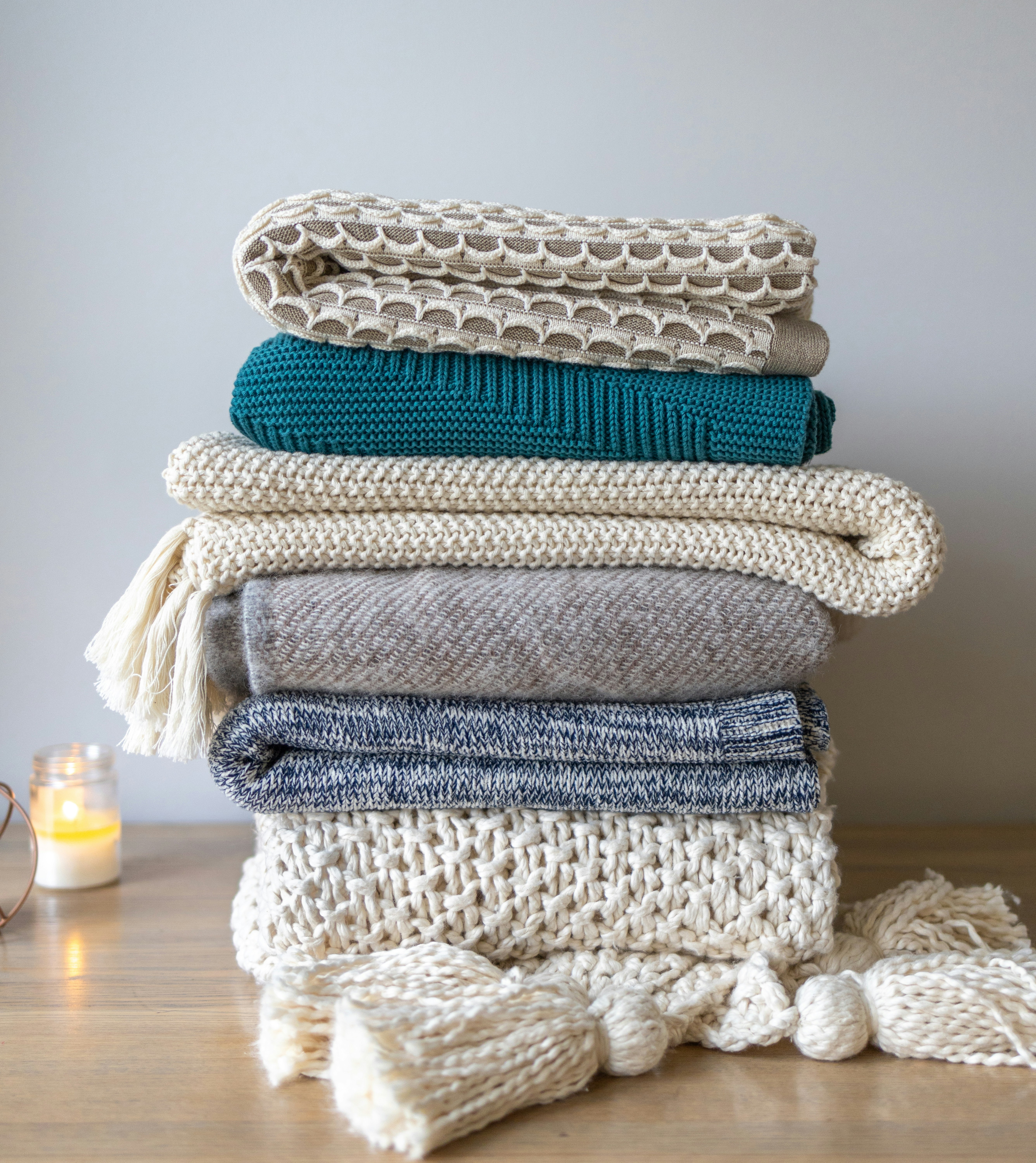 Soft woven throw folded on an armchair